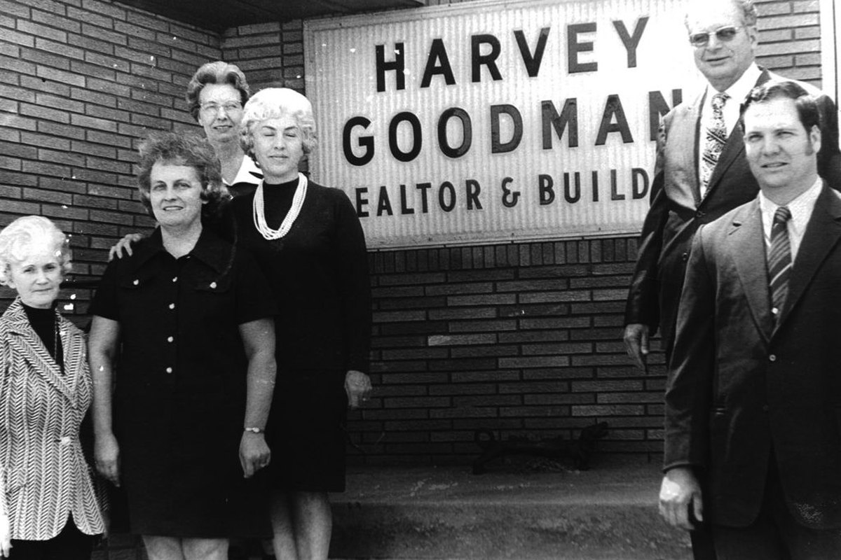 The Goodman family in front of the original Harvey Goodman, Realtor & Builder office